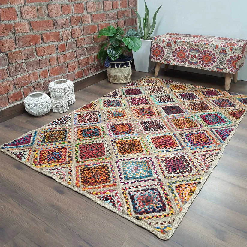 Handwoven natural jute and cotton chindi patchwork area rug with rich textured surface and artisan detailing, for bohemian and eclectic interiors