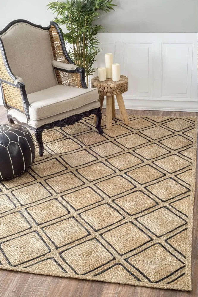 Handwoven natural jute area rug with black geometric diamond pattern, braided texture for modern, bohemian, and earthy interiors