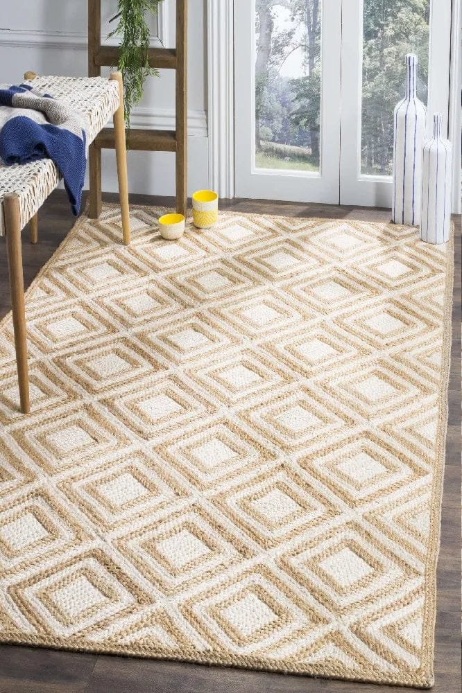Braided natural white diamond jute hand-woven area rug with modern zig-zag pattern, neutral tones for bohemian and coastal interiors
