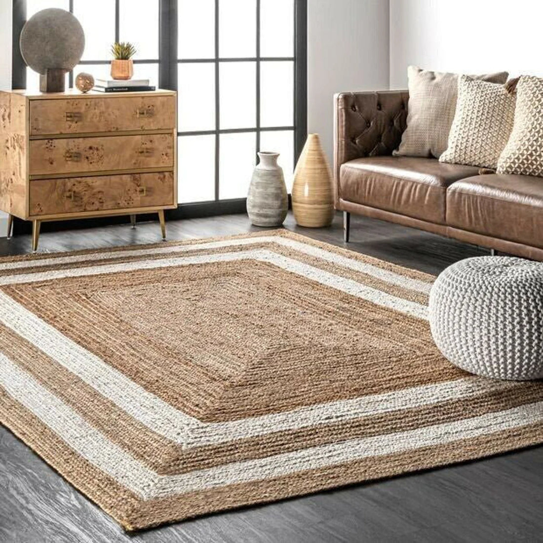 Handwoven natural jute area rug with clean framed border design, warm organic texture for minimalist, bohemian, and coastal interiors